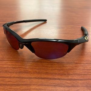 Used Oakley Half Jacket sunglasses. Minimal scratches on the lens.